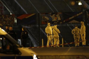 Investigating police officers are pictured outside the Stade de France stadium after an international friendly soccer match France against Germany, in Saint Denis, outside Paris, Friday Nov. 13, 2015. During the first half of France's soccer match against Germany on Friday, two explosions went off nearby. French President Francois Hollande declared a state of emergency and announced that he was closing the country's borders. (AP Photo/Michel Euler)